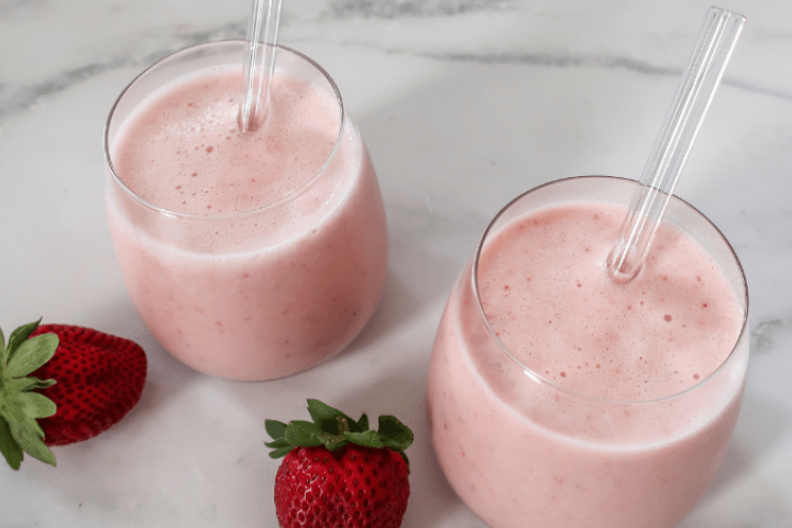 Kefir berry and banana smoothies with strawberries on the side