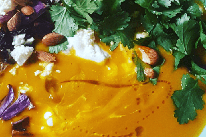 Close-up of a colourful spiced pumpkin soup.