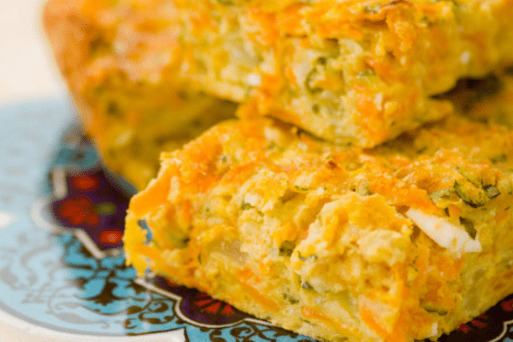 A serving of zucchini, carrot and fetta slice.