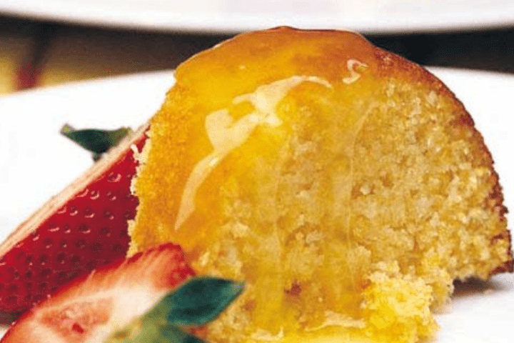 Orange cake with strawberries for decoration