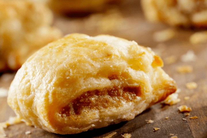 A close up of a cooked sausage roll