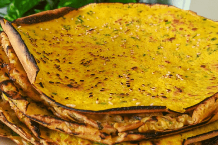 A stack of chapati or flat bread on a plate