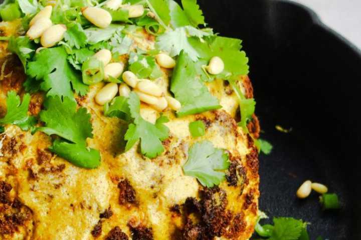 Close up of roasted cauliflower in fry pan.