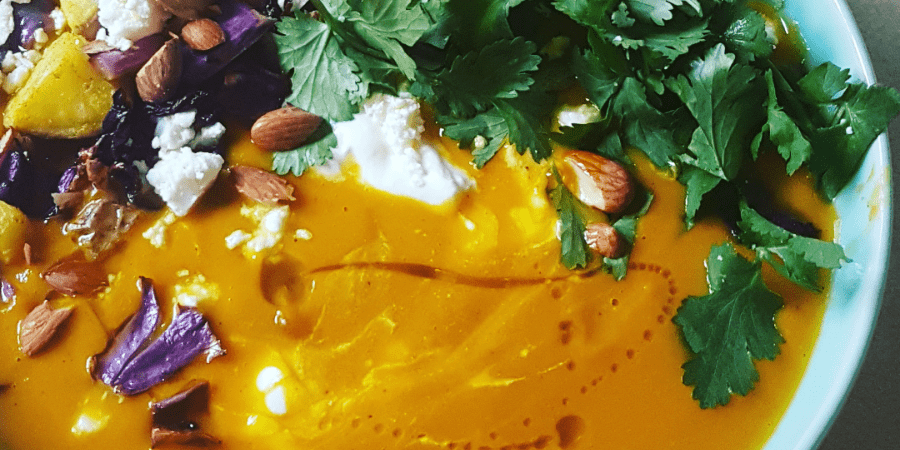 Close-up of a colourful spiced pumpkin soup.