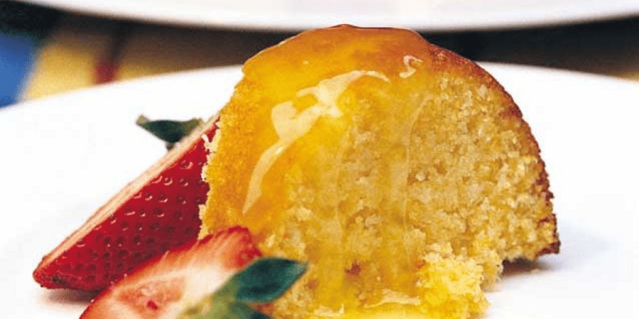 Orange cake with strawberries for decoration