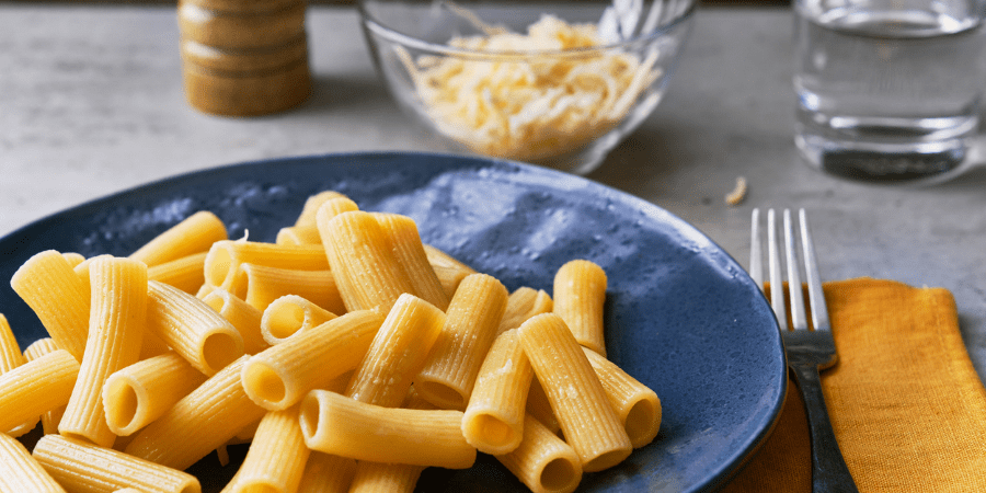 Rigatoni pasta in a blue bowl