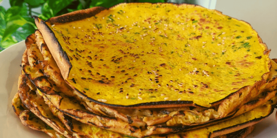 A stack of chapati or flat bread on a plate