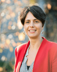 Woman with red blazer and short brown hair