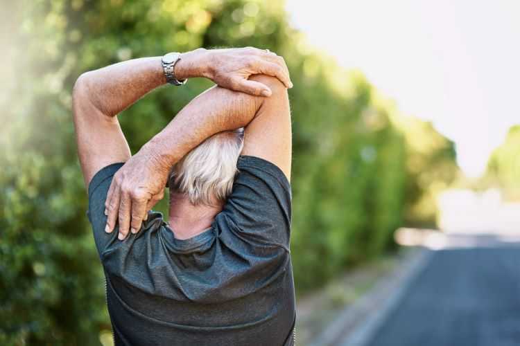 A man stretching outside