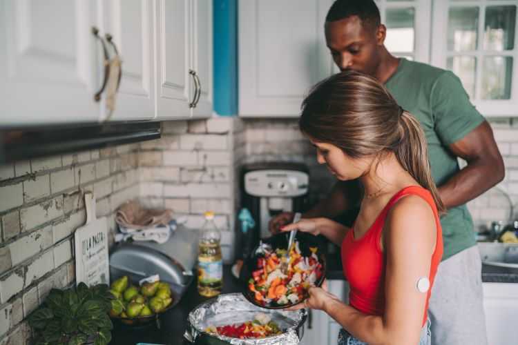 A couple cooking in the kitchen