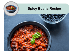 A bowl of spicy beans garnished with a fresh basil leaf, placed next to a smaller bowl of black beans.